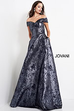Model wearing Jovani 03674 navy dress with shimmering texture, front view