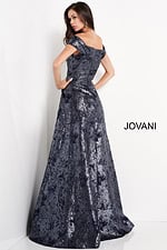 Model wearing Jovani 03674 navy dress with off-the-shoulder neckline, back view