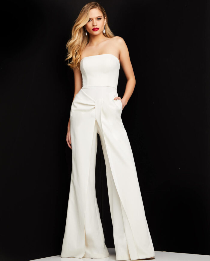 Model wearing Jovani 03828 ivory strapless jumpsuit front view highlighting modern design.