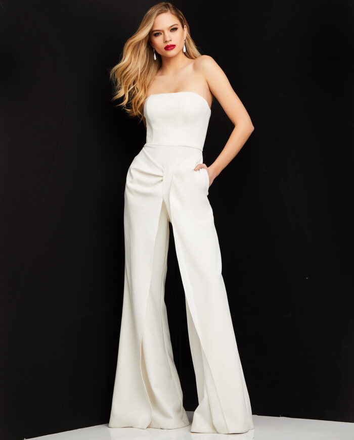 Model wearing Jovani 03828 ivory strapless jumpsuit front view with elegant wide-leg pants.