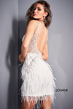 model wearing Jovani 04042 off-white dress, back view with low cut design