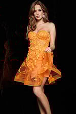 model wearing Jovani 04109 orange dress with floral appliqués, front view