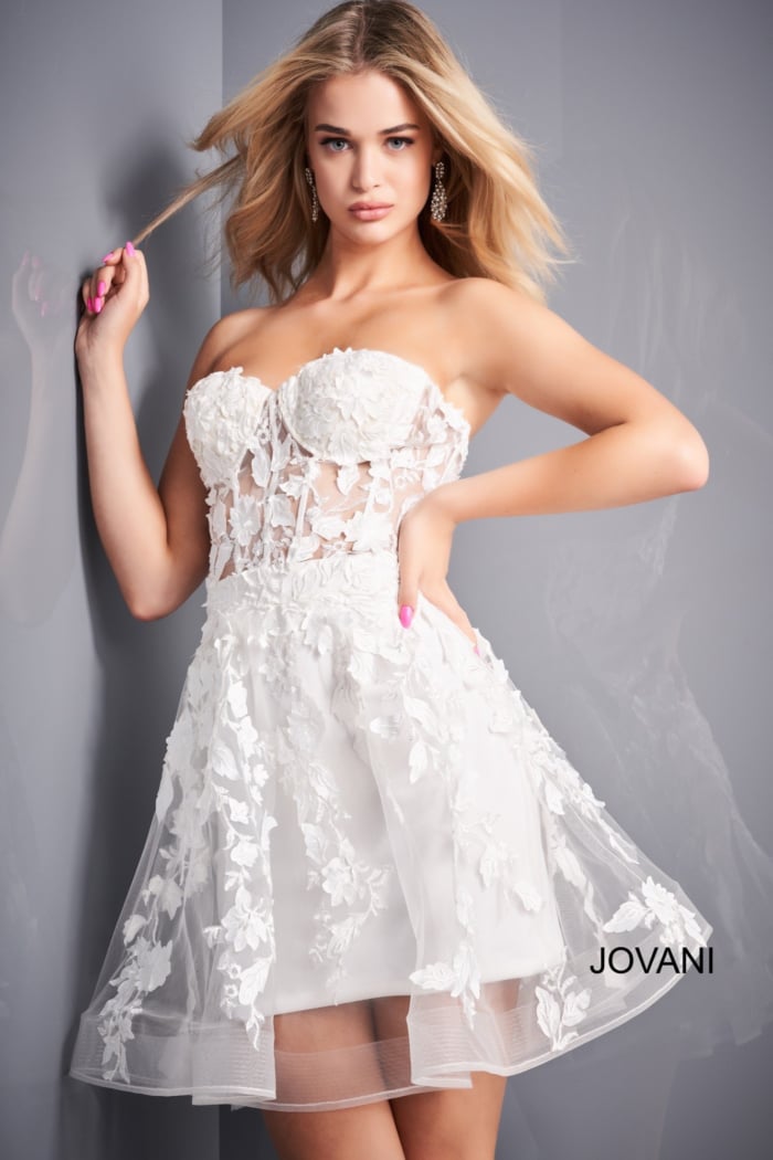 model wearing Jovani 04109 white dress with floral appliqués, front view