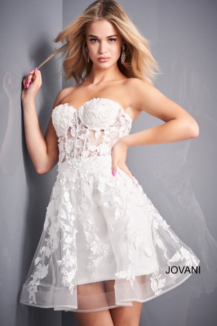 Model wearing Jovani 04109 off-white dress with floral details, front view