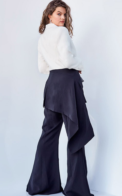 Model wearing Jovani 04148 black and ivory jumpsuit, back view showing blazer-style detail.