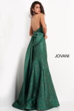 Back view of model wearing Jovani 04158 green gown with large bow accent.