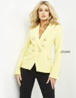 Model wearing Jovani 04171 yellow blazer leaning against a wall.