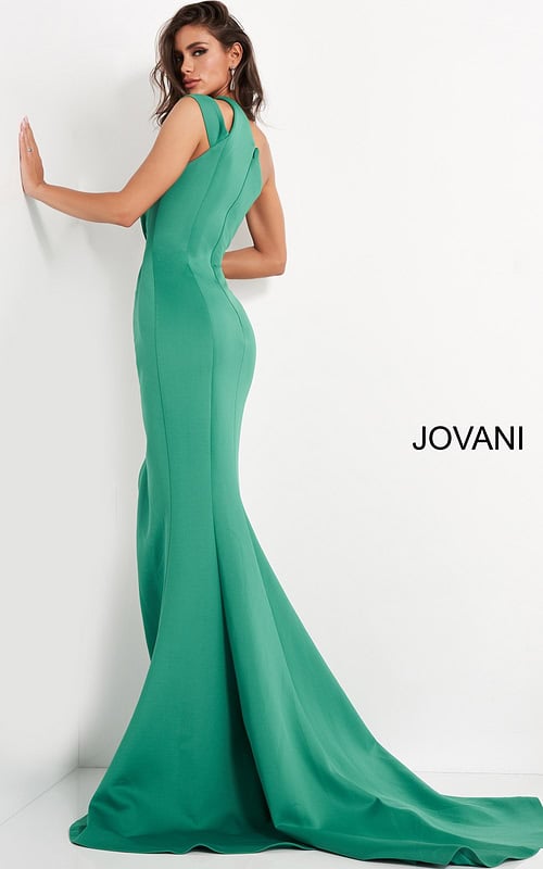 Back view of model wearing Jovani 04222 green gown with flowing hem.