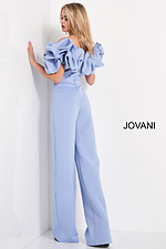 back angle of model in Jovani 04369 light blue jumpsuit with large ruffled details