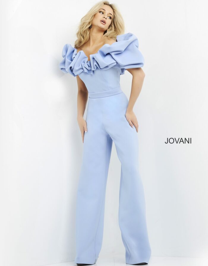 Model wearing Jovani 04369 light blue jumpsuit with ruffled sleeves, front view.