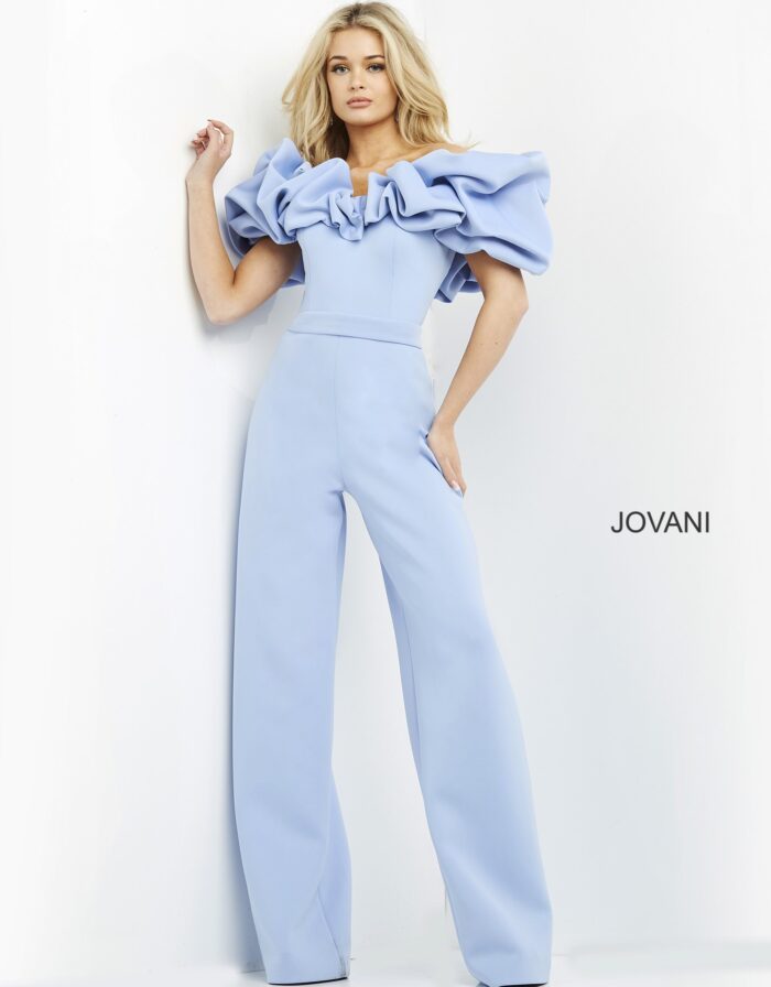 Model in Jovani 04369 light blue jumpsuit with wide-leg pants, full front view.