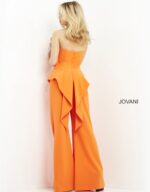 Model wearing Jovani 04427 orange jumpsuit, back view