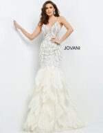Front view of Jovani 04625 off-white gown emphasizing beadwork and feather skirt.