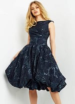 Model wearing Jovani 05016 navy A-line dress with bateau neckline.