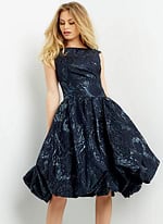 Model showcasing Jovani 05016 navy dress, perfect for formal settings.