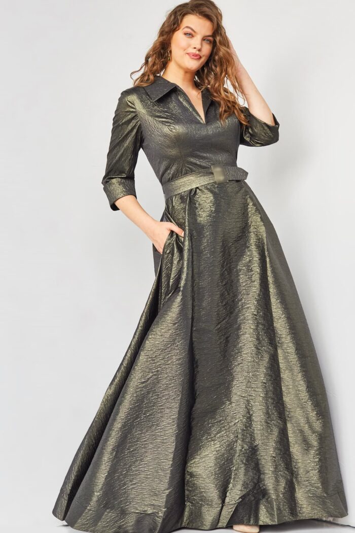 Back of model wearing Jovani 05075 showing the flowing green skirt and sleeve length.
