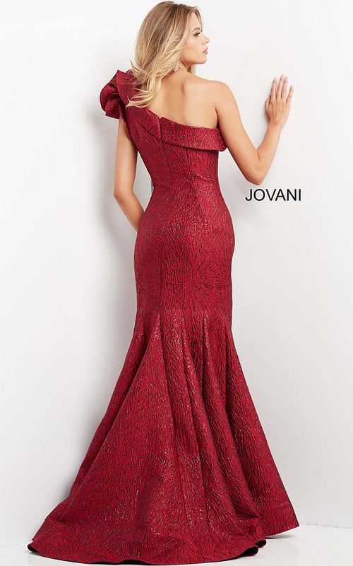 Back view of model in Jovani 05176 burgundy dress with dramatic ruffle detail.