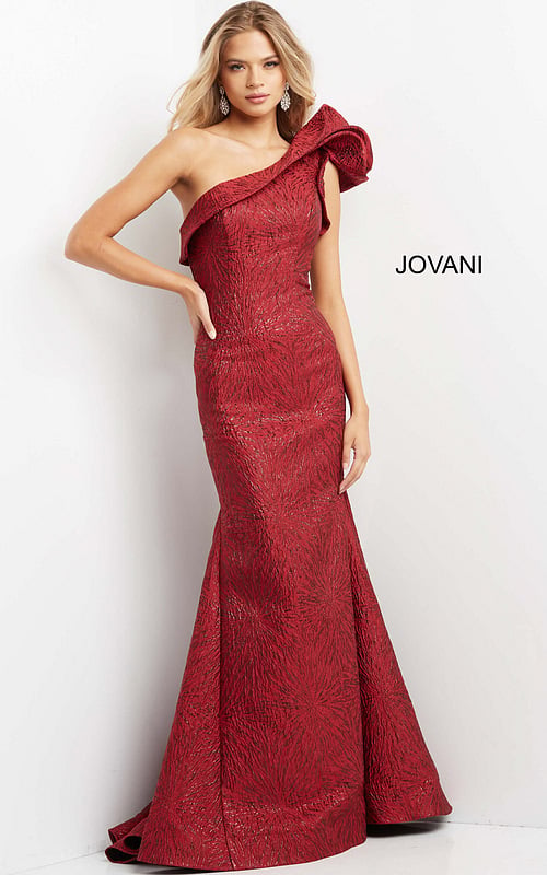 Model wearing Jovani 05176 burgundy dress with one-shoulder design and mermaid silhouette.