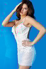 Model showcasing Jovani 05282 with floral design and sequin work in beige.