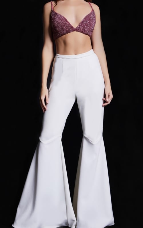 Model in Jovani 05308 white pants with beaded top, front view.