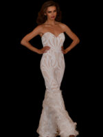 Model wearing Jovani 05669 white jumpsuit with sweetheart neckline and feathered hem.