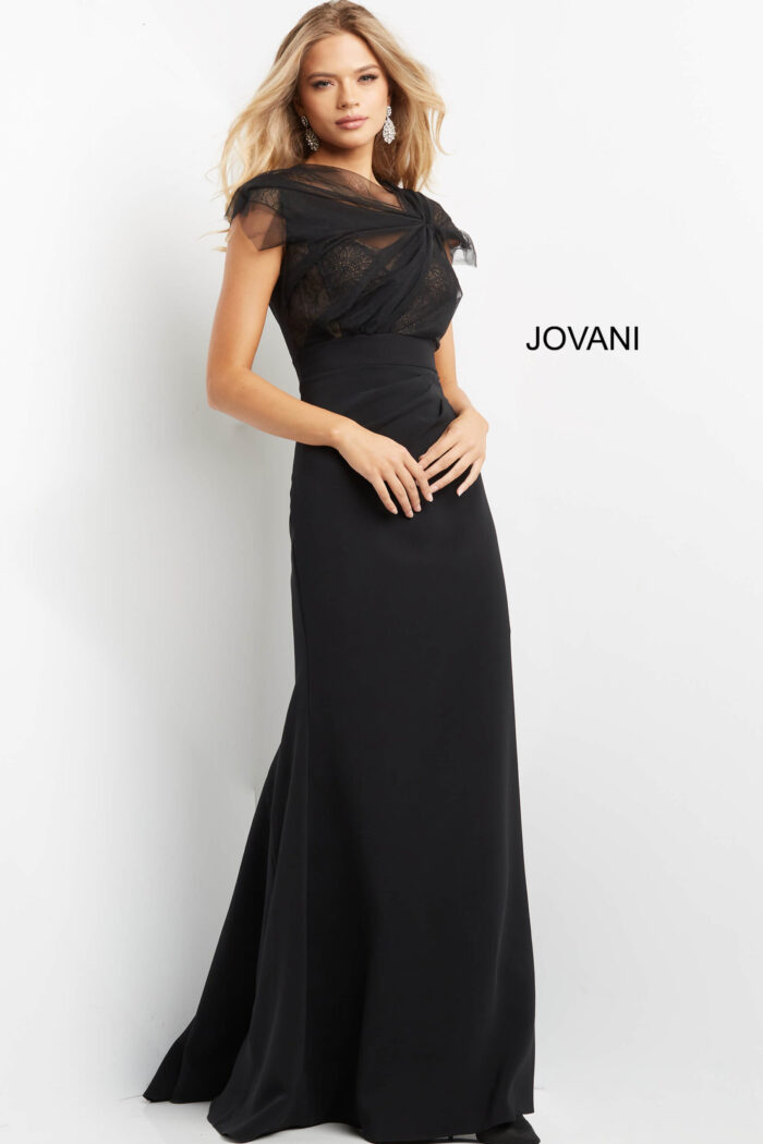 Model showcasing Jovani 05675 black gown with illusion neckline.