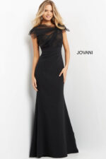 Model posing in Jovani 05675 black evening gown with short sleeves.