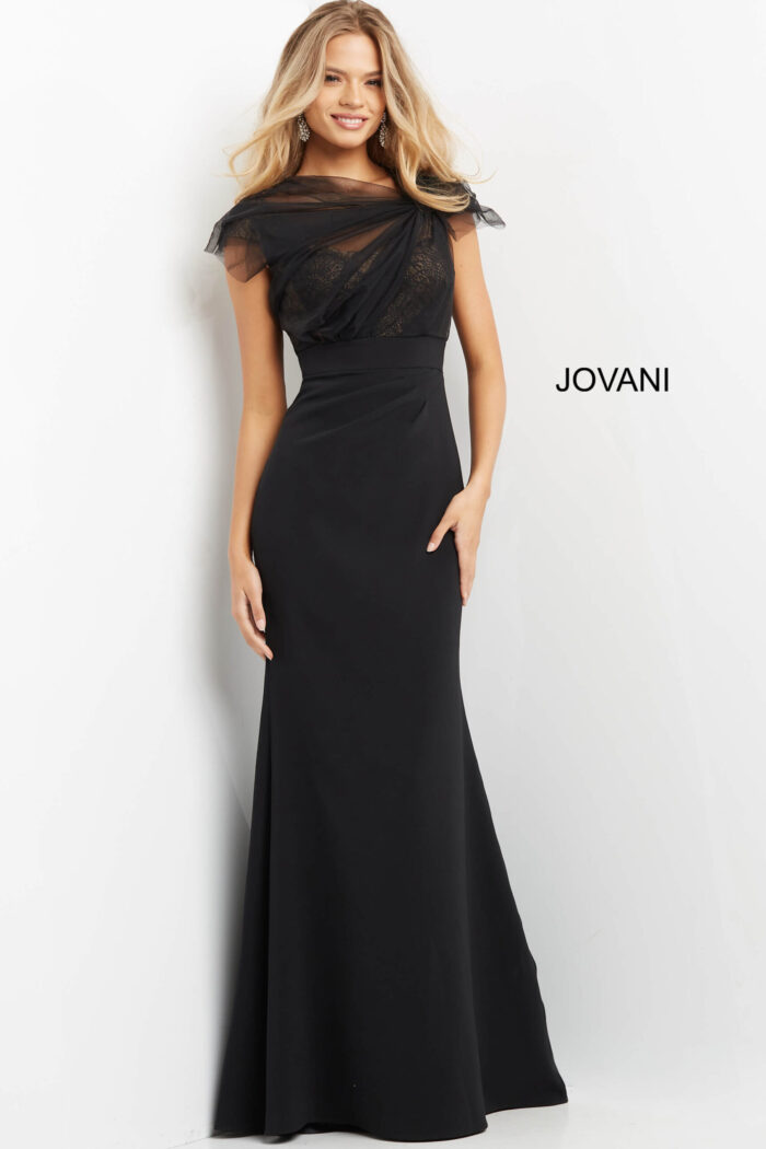 Model posing in Jovani 05675 black evening gown with short sleeves.