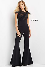 Full-length view of model in black Jovani 05676 jumpsuit with elegant details.