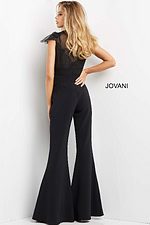 Back view of model in Jovani 05676 black jumpsuit featuring elegant lace design.
