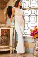 Side view of model in Jovani 05676 ivory jumpsuit with lace and flared legs.