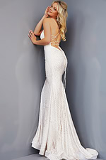 Model showcasing the lace-up back of the Jovani 05960 white gown.