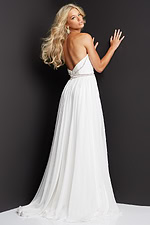 Back view of model in Jovani 05971 white chiffon dress, showcasing elegant pleats.