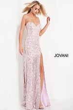 model wearing 06109 ice pink gown with thin straps and high slit