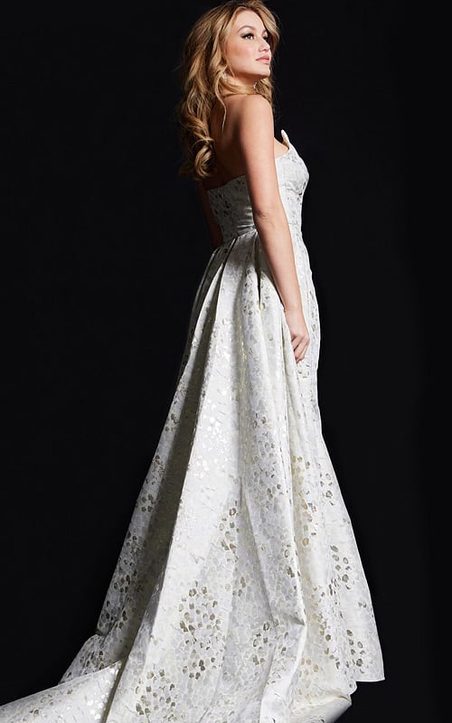 back view of model in 06255 beige gown with textured pattern