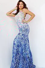 Model posing from side in Jovani 06450 silver dress.