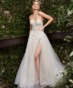 Model in Jovani 06610 white gown, showing sweetheart neckline and flowing skirt.
