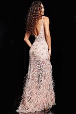 back view of model wearing Jovani 06622 light pink gown with V-neck and feathered hem