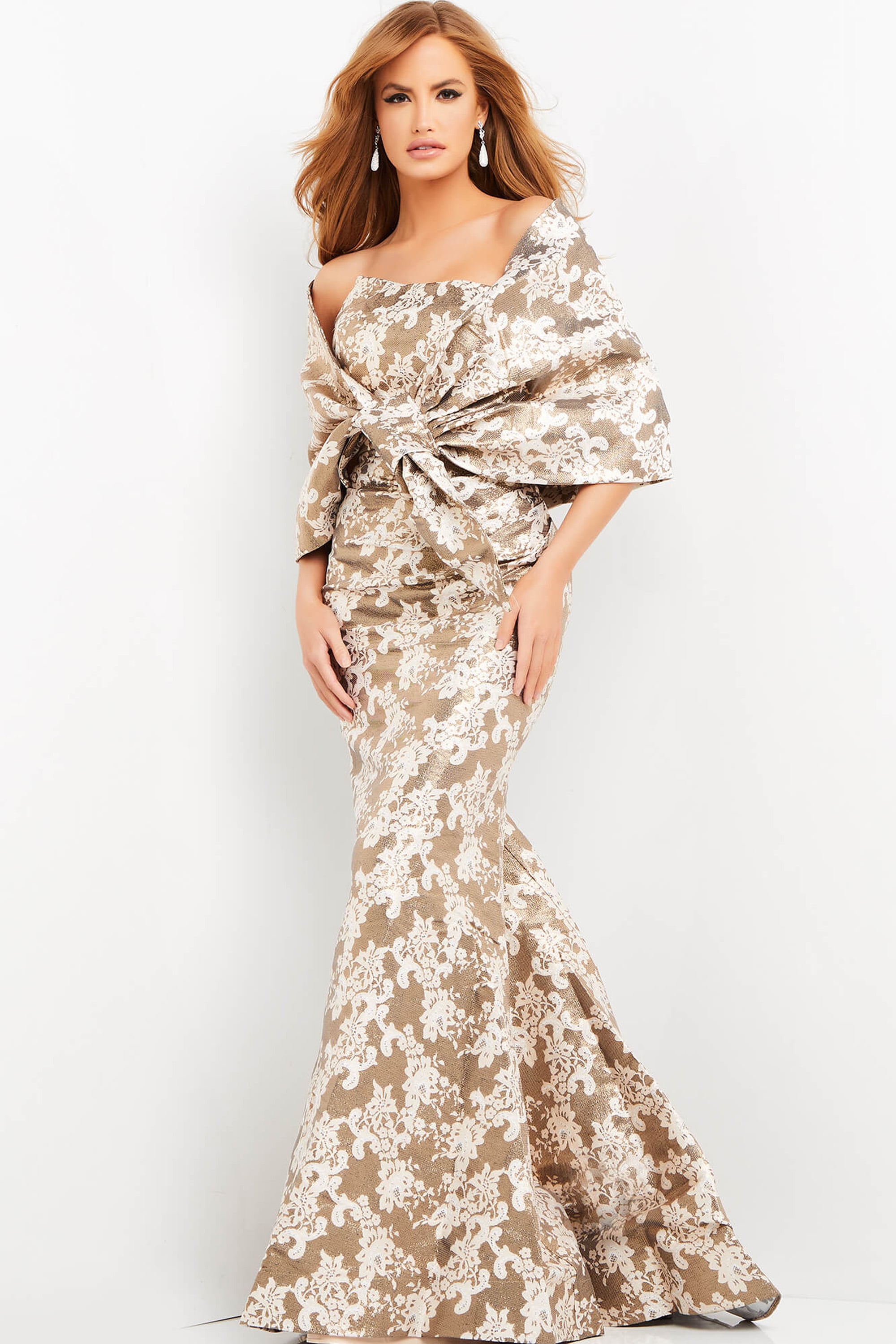 06760-print.jpg Model wearing Jovani 06760 beige mermaid dress with off-the-shoulder neckline.