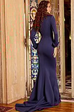 Model wearing Jovani 06774 navy dress, back view