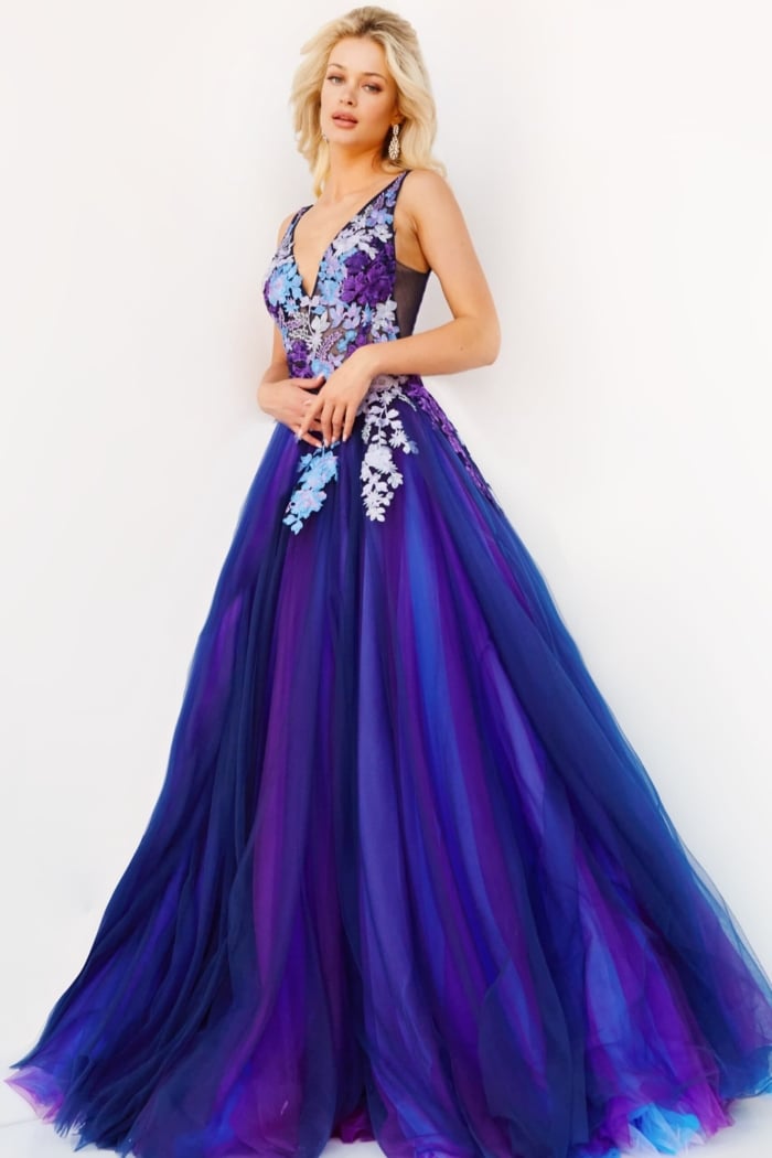 Model wearing Jovani 06807 dress in navy multi, front view highlighting flowing skirt.