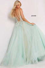 Back view of Jovani 06816 showing lace-up design and full skirt in green.