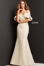 Model in Jovani 06831 beige dress, illustrating off-the-shoulder design and elegant fit.