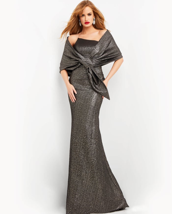 Model wearing Jovani 06867 in brown with shawl, front view.