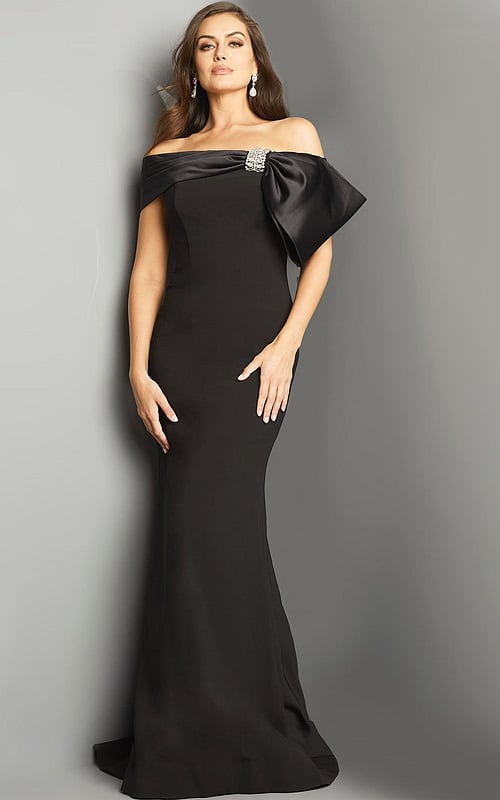 Model wearing Jovani 07014 black dress with bow detail.