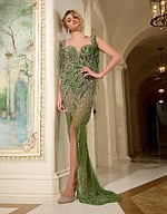 Model wearing Jovani 07031 green gown with sweetheart neckline and beaded fringe sleeves.