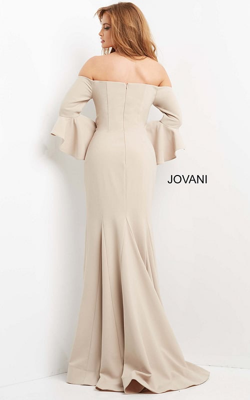 Model wearing Jovani 07065 elegant beige gown showing back view with mermaid silhouette and off-the-shoulder neckline.