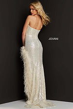 Model wearing Jovani 07068 beige gown with sequins and feather details, back view.