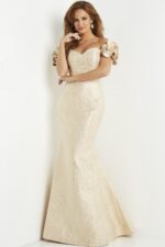 Model wearing Jovani 07154 gold dress, front view, showing off the mermaid silhouette and detailing