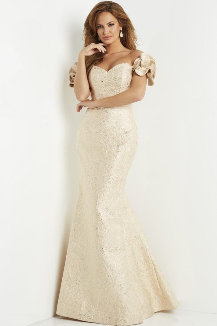 Model wearing Jovani 07154 gold dress, front view, showing off the mermaid silhouette and detailing
